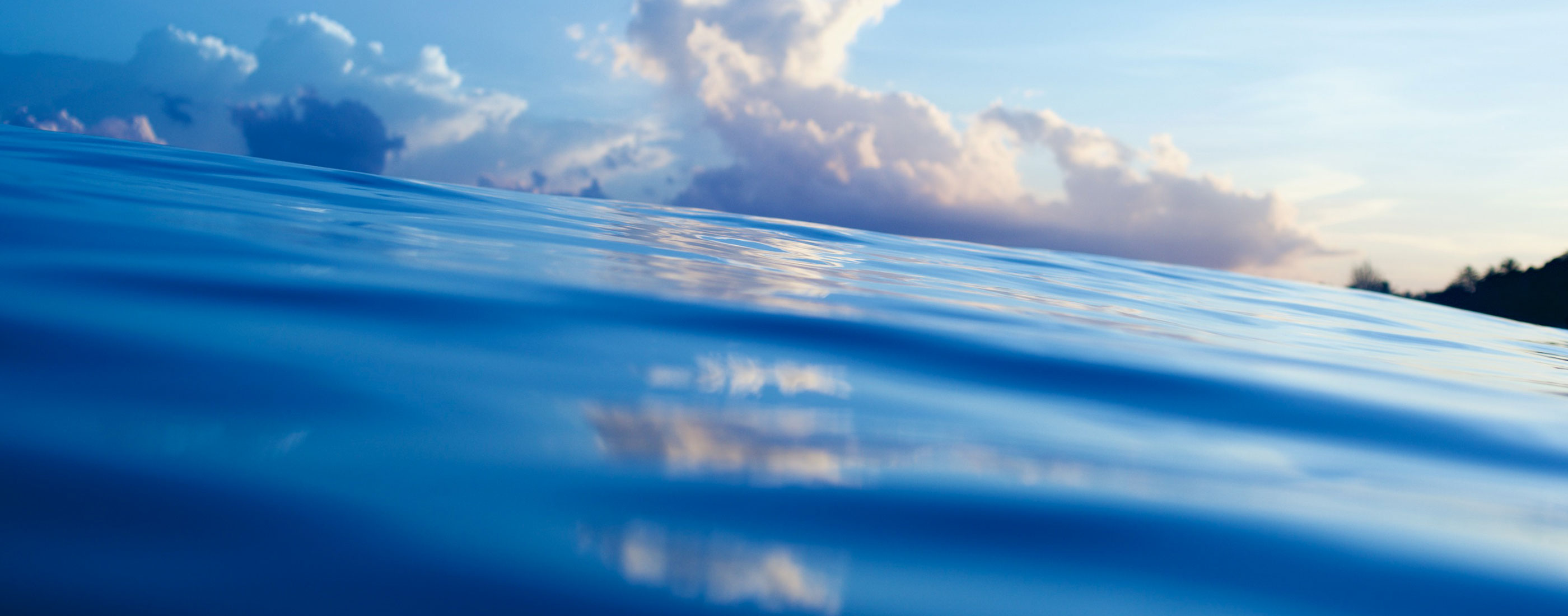 Surfrider-Connecticut-Programs-close-up-of-waves-with-clouds-in-background